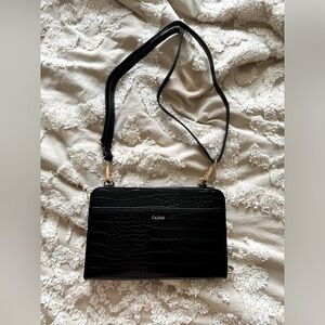 NWOT Calpack travel clutch with strap